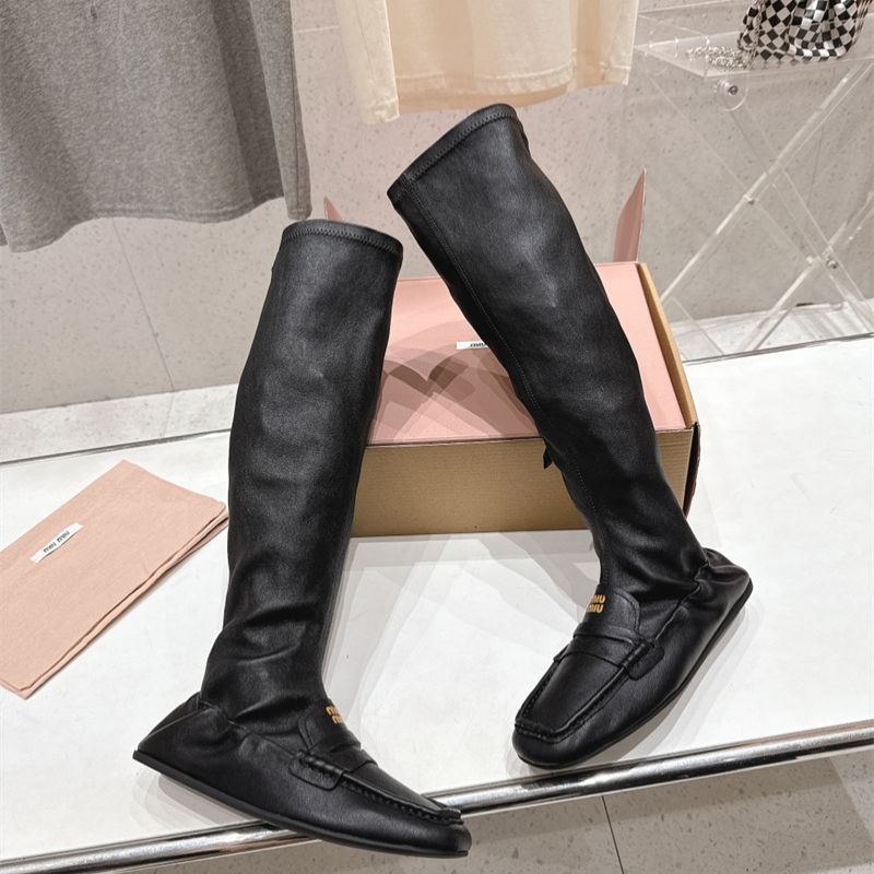 Miu Miu "Loafer" Knee-High Boots.
