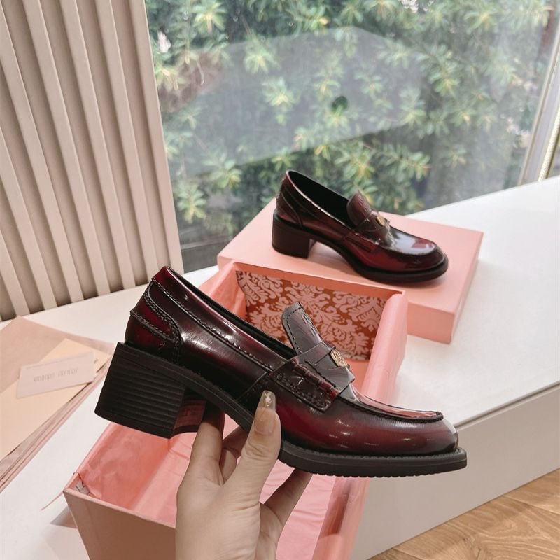 Miu Miu Brushed Leather Penny Loafers with a lug sole.