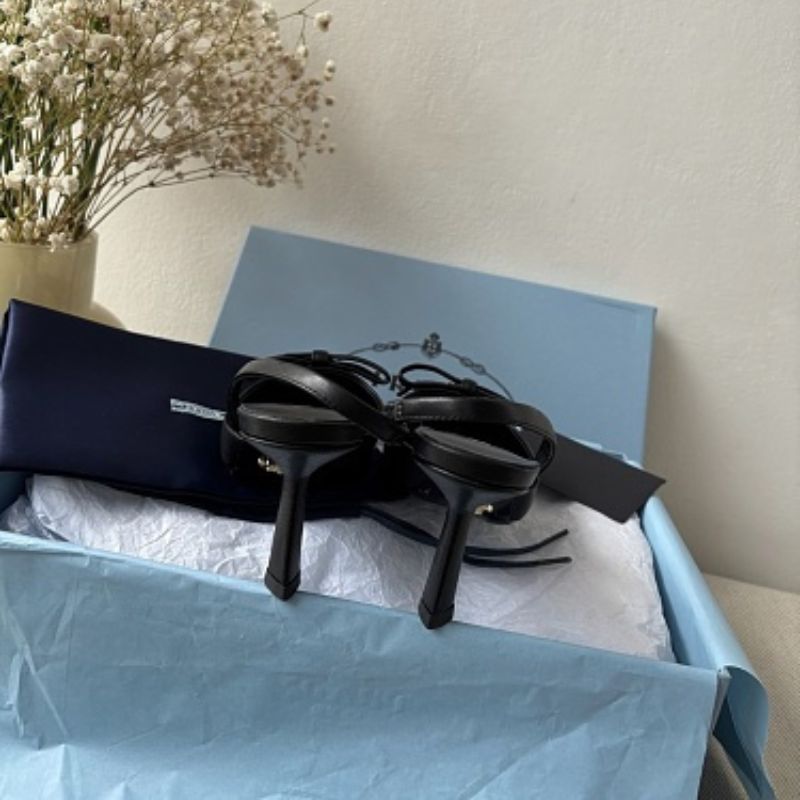 Prada Smooth Leather Bow Slingback Pumps in black.