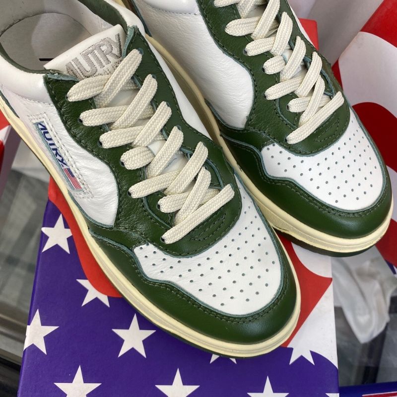 Louis Vuitton Low-Top Sneakers in a white and green