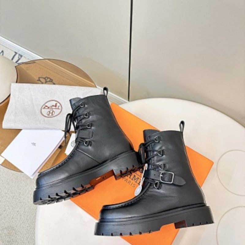Hermès Land ankle boots in a classic black colorway.
