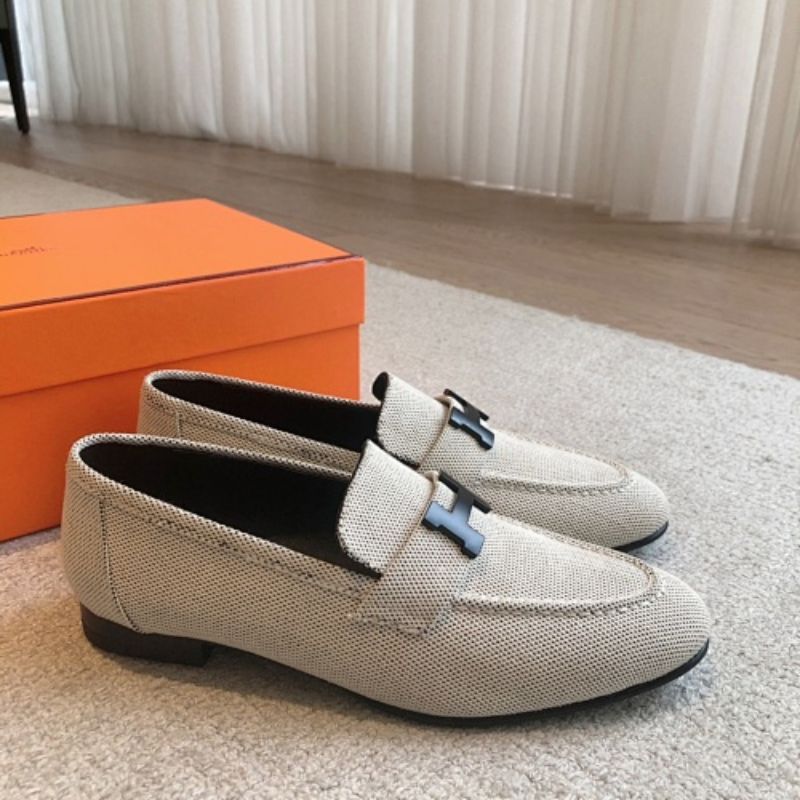 Hermès Paris Loafers in a textured, woven cream fabric finish.