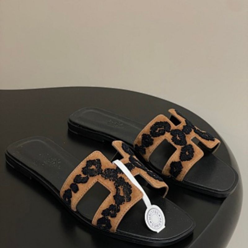 Hermès Oran sandals in a distinctive tricolor leopard-print design