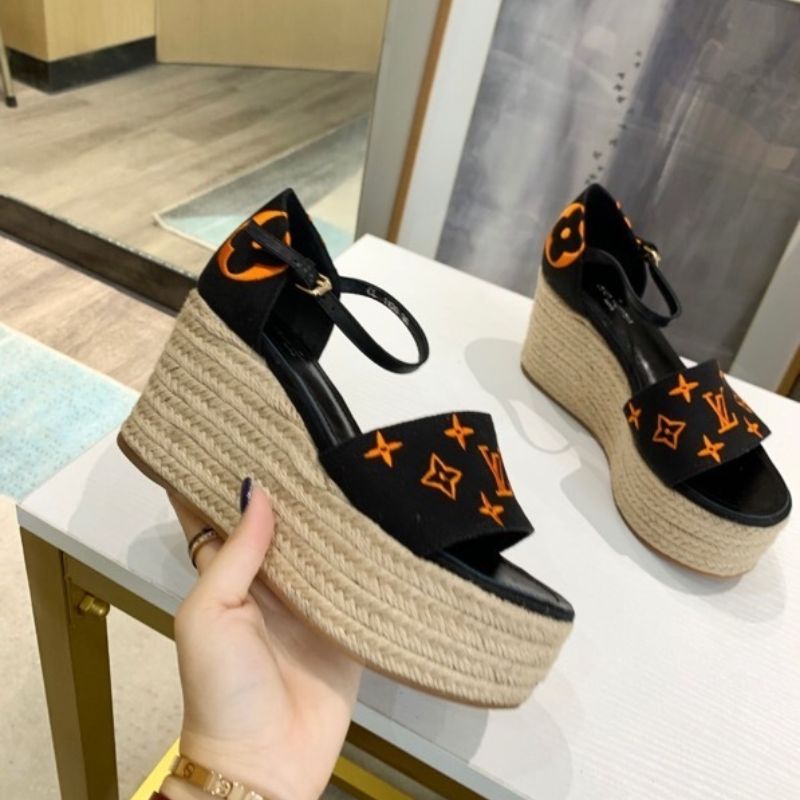Louis Vuitton Starboard Wedge Sandal in a black and orange