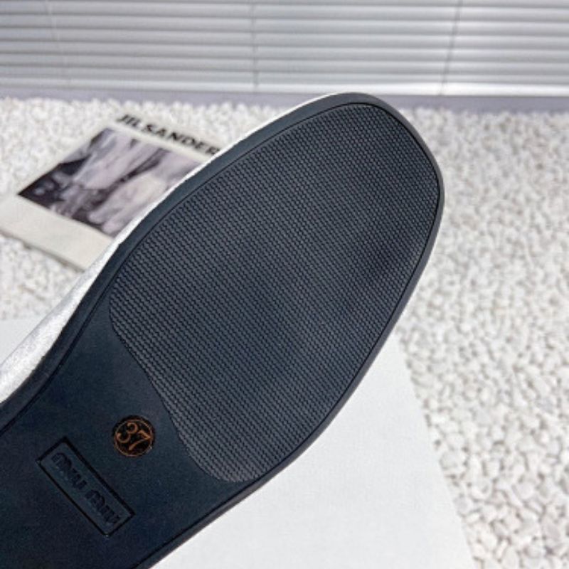 Miu Miu Bow Loafers.