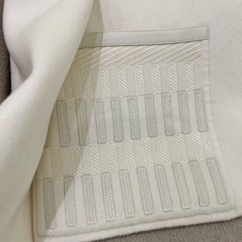 Hermès white cropped jacket with an asymmetrical front closure