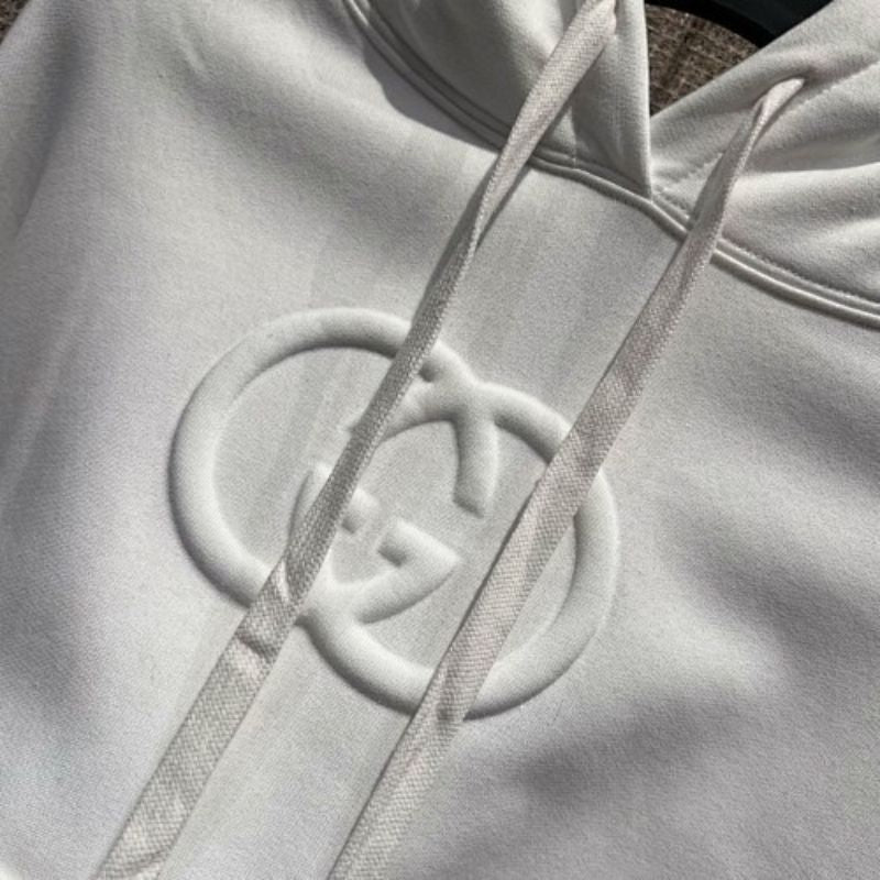 Gucci Logo-Embossed Hoodie in white.