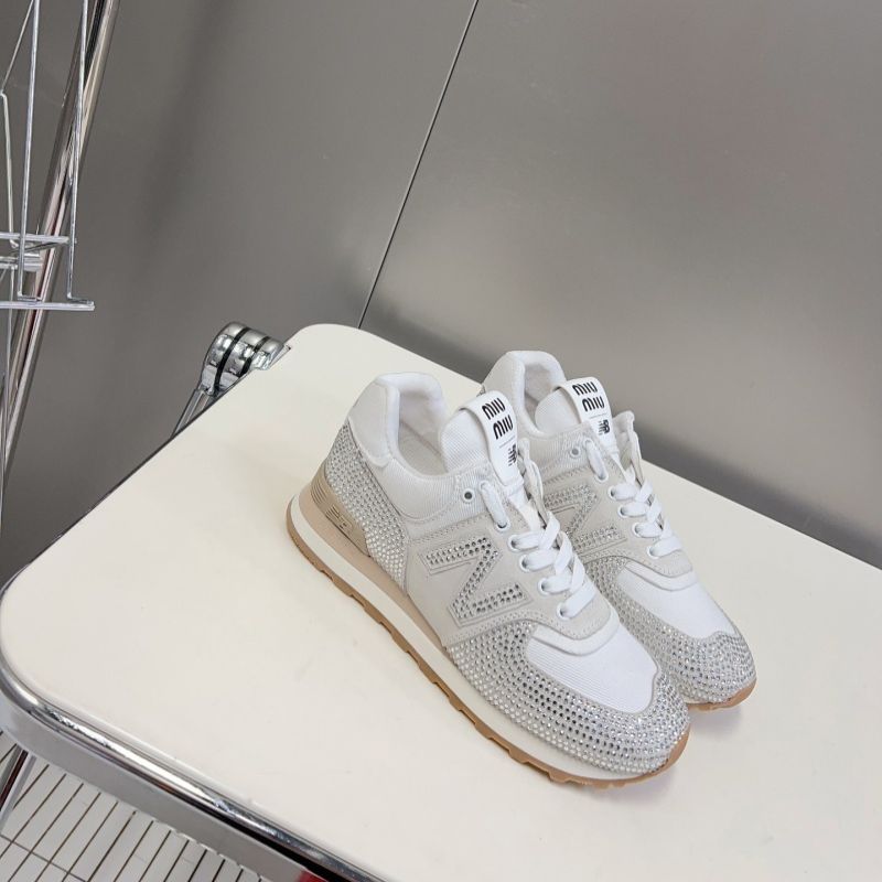 Miu Miu x New Balance 574 crystal-embellished sneakers.