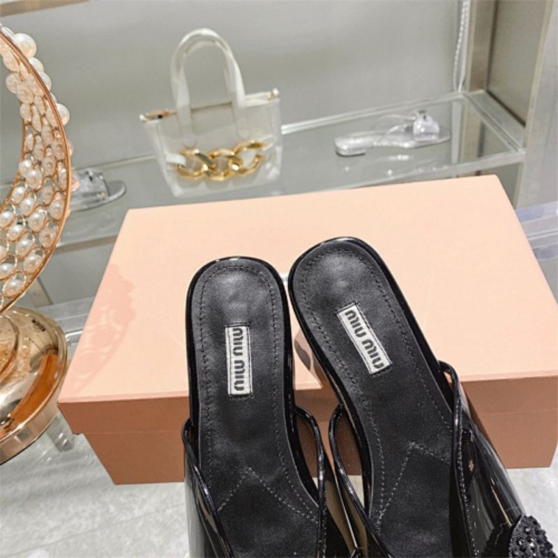 miu miu crystal embellished bow mules in black
