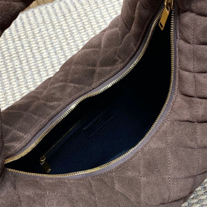 Saint Laurent Icarino a rounded top-handle bag .