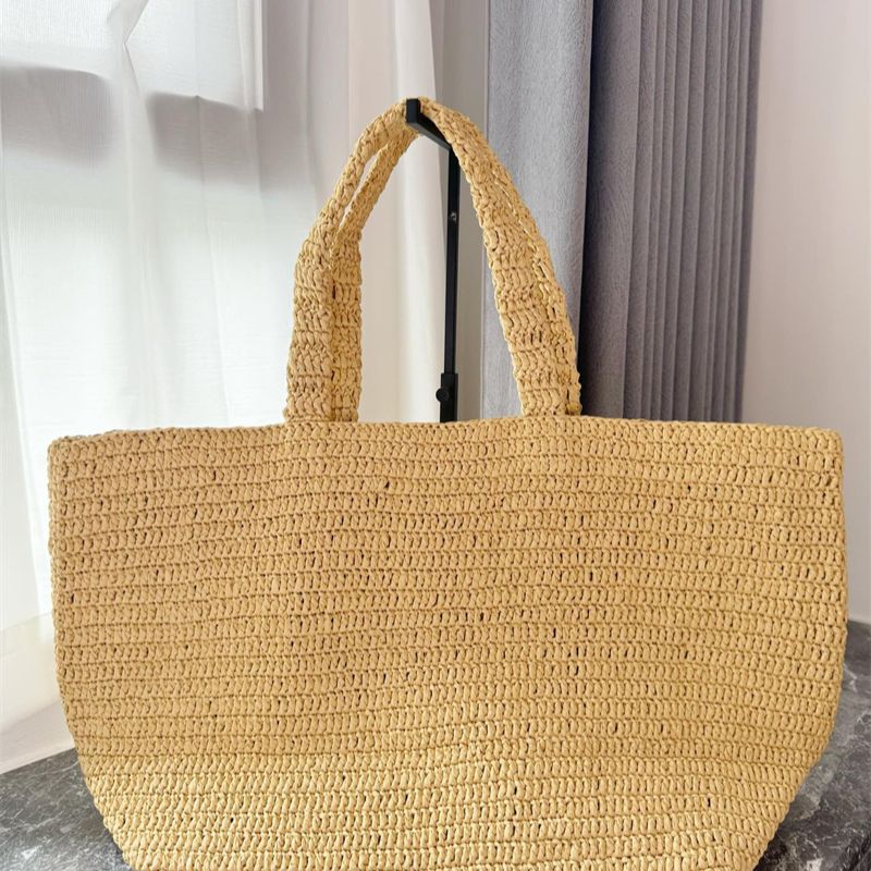 Saint Laurent Rive Gauche raffia tote bag.