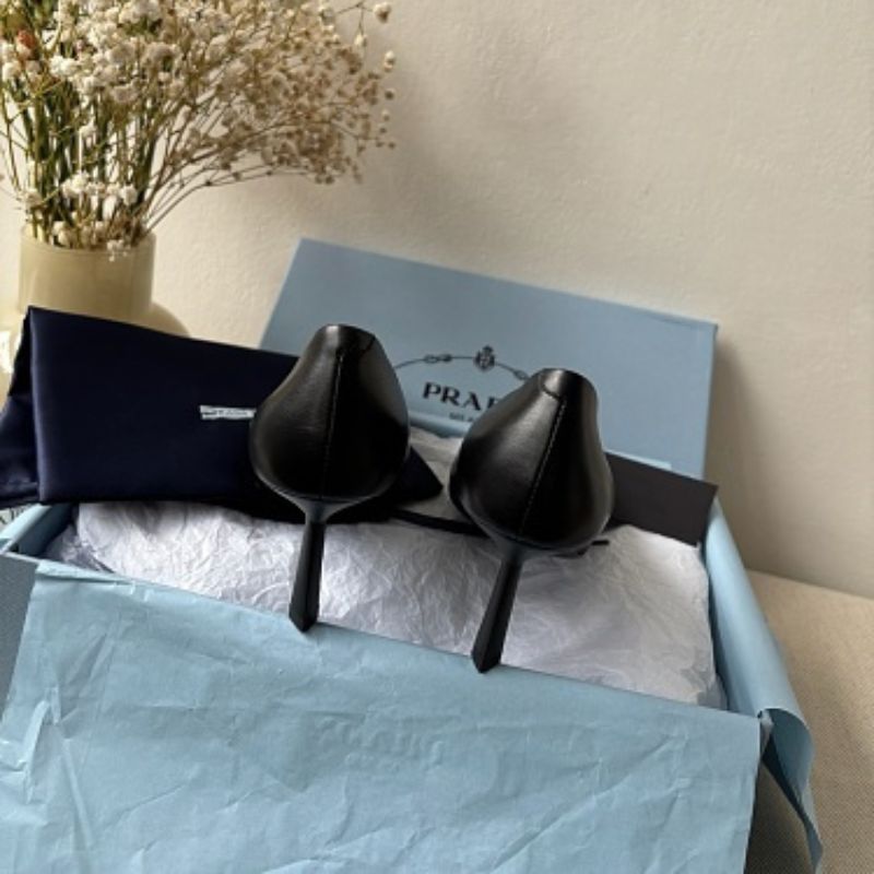 Prada 75mm Padded Triangle-Logo Leather Pumps.