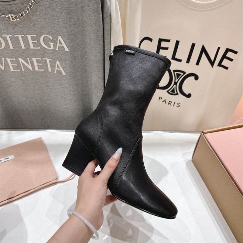 Miu Miu black leather square-toe ankle boots with a zipper closure