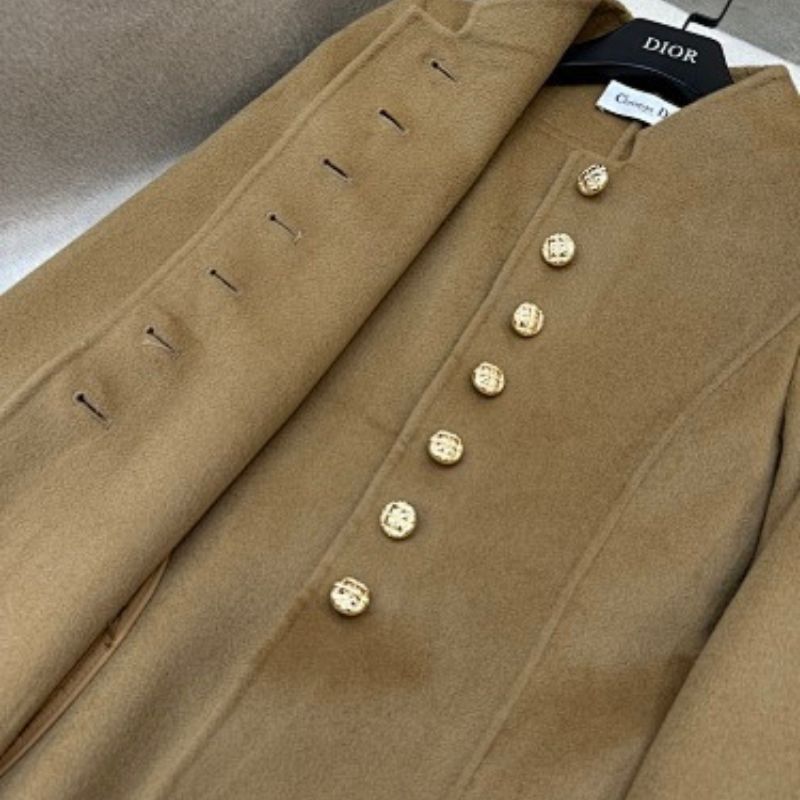 Christian Dior camel coat with gold-tone logo buttons.