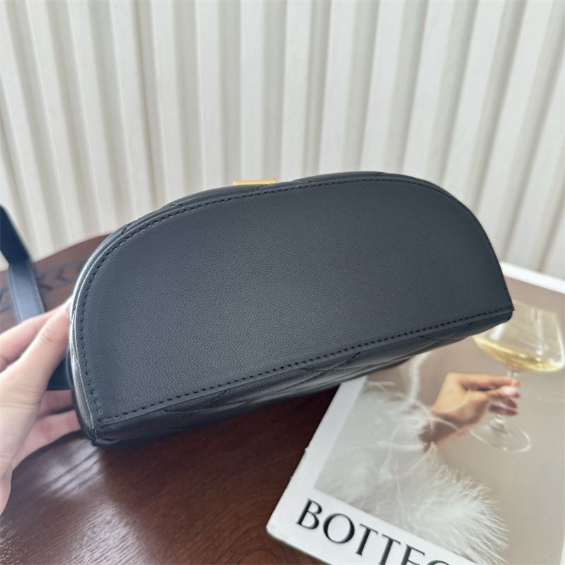 Saint Laurent June Box Bag in black quilted leather.