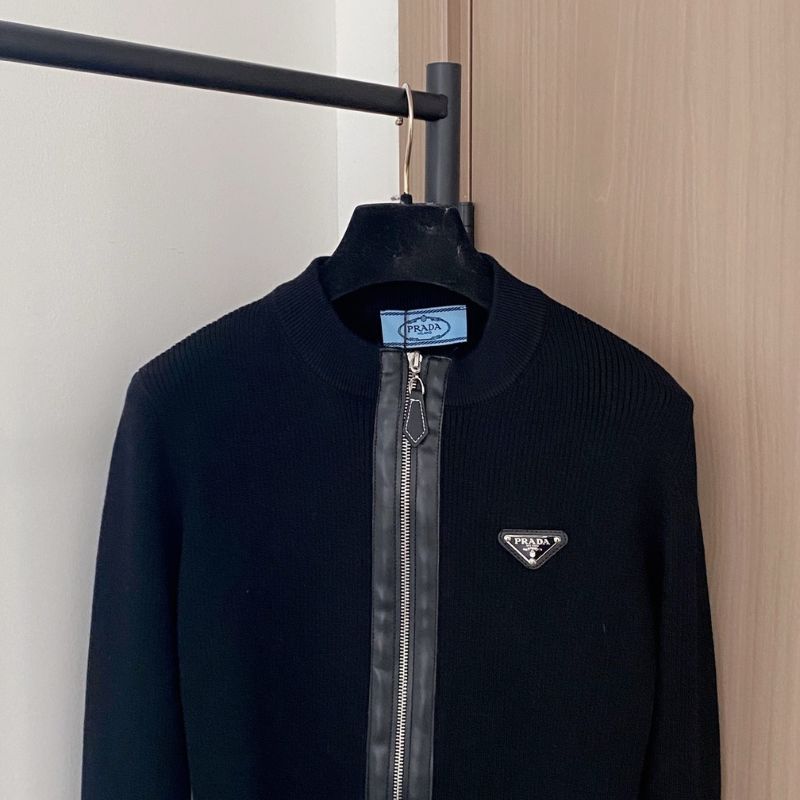 Prada black knit jacket with a full zip closure.