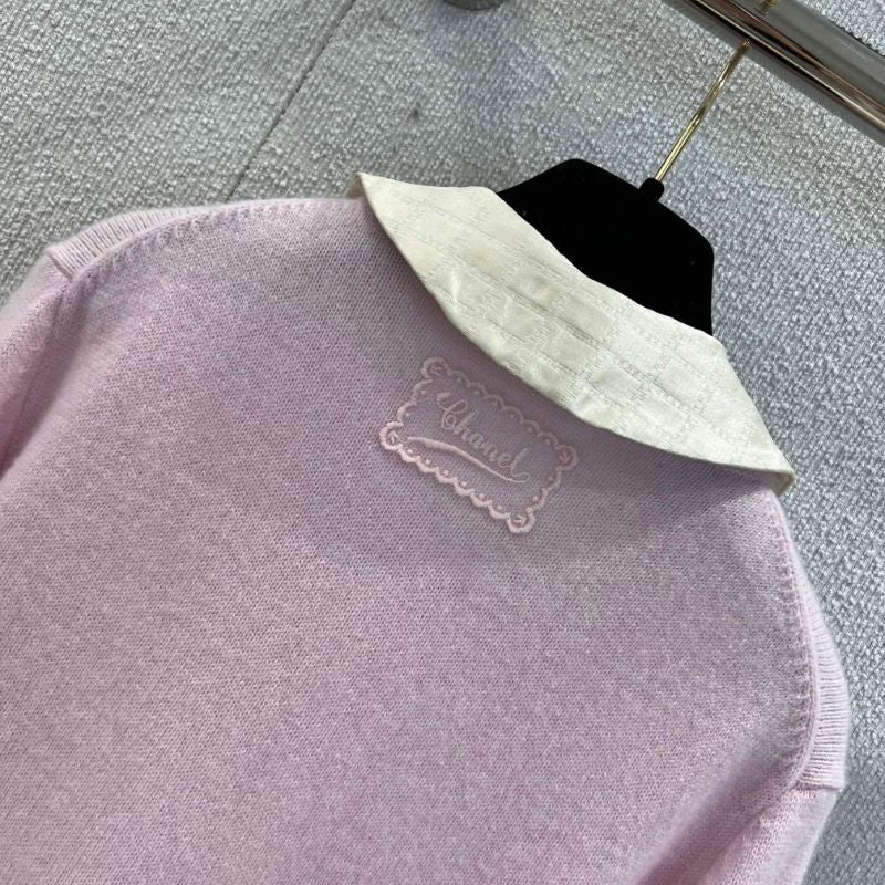 Chanel-style pink knitted cardigan with a white Peter Pan collar