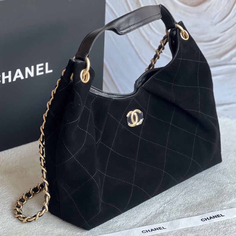 Chanel hobo bag with a gold chain strap and a prominent CC logo closure
