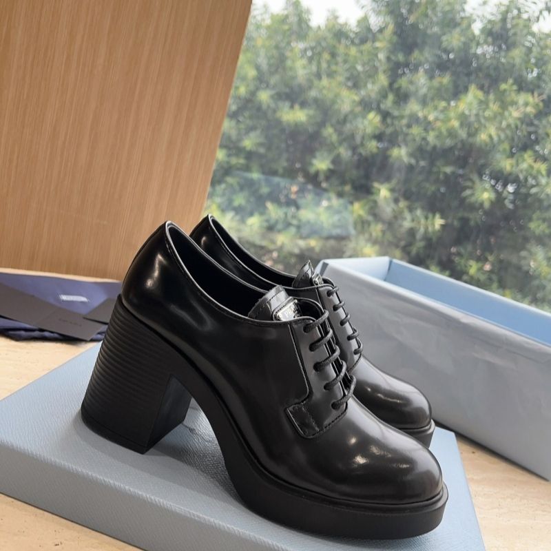 Prada Heeled Brushed Leather Lace-Ups in Black