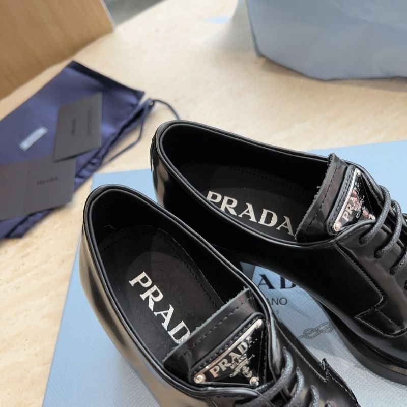 Prada Heeled Brushed Leather Lace-Ups in Black