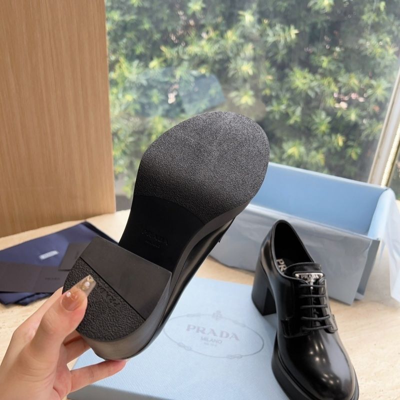 Prada Heeled Brushed Leather Lace-Ups in Black