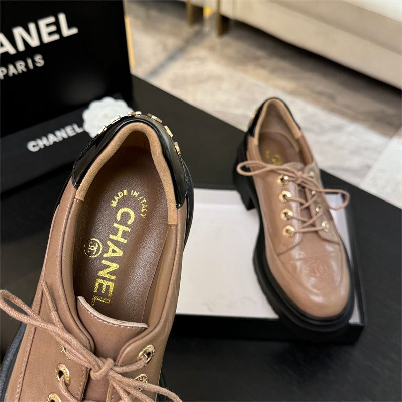 Chanel two-tone platform lace-up shoes.