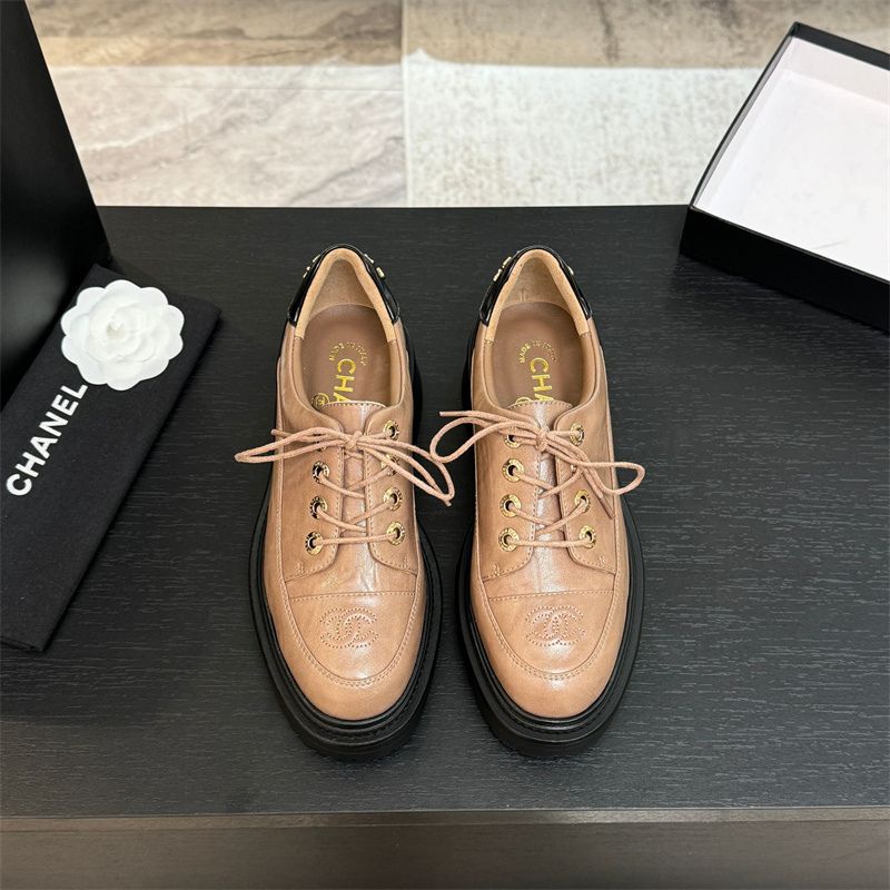 Chanel two-tone platform lace-up shoes.