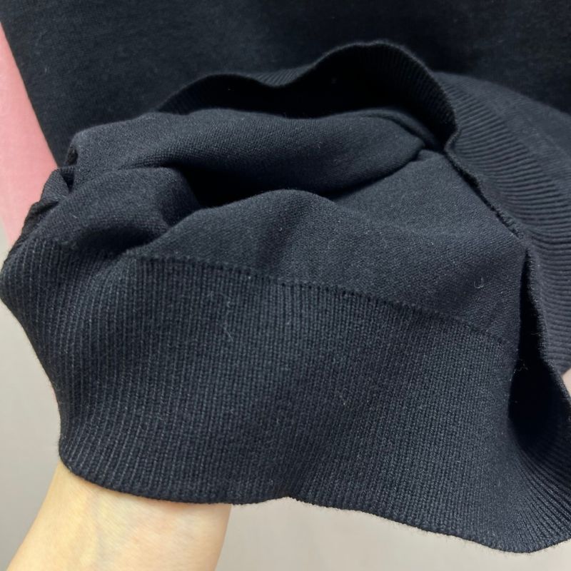 Miu Miu layered knit sweater.