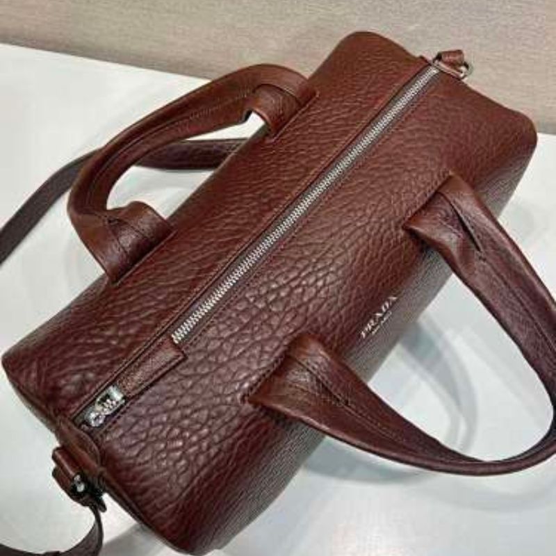 Prada Arqué Leather Tote Bag in a rich cocoa brown.