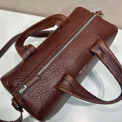 Prada Arqué Leather Tote Bag in a rich cocoa brown.