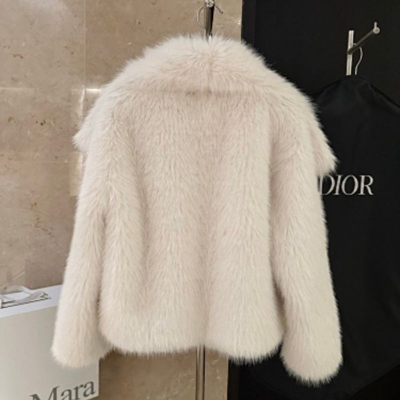 white Christian Dior fur jacket,