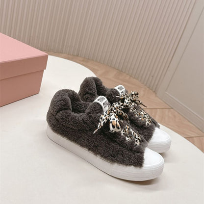 Miu Miu Shearling Fur Sneakers.