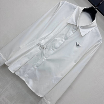 Prada poplin shirt with a pleated panel and safety pin detail.