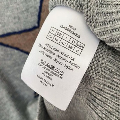 grey Christian Dior cropped sweater with a brown/tan star motif.