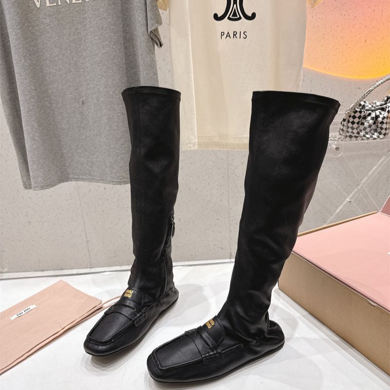 Miu Miu "Loafer" Knee-High Boots.