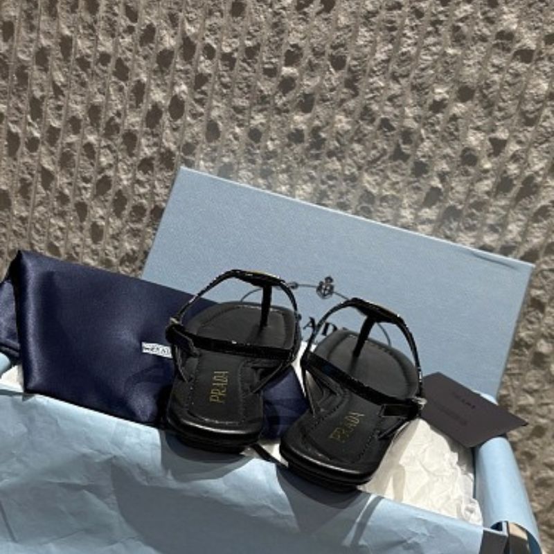 Prada Patent Leather T-Strap Enameled Triangle Logo Sandals.