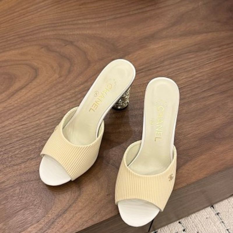 Chanel Ribbed Knit Open-Toe Mules in beige.