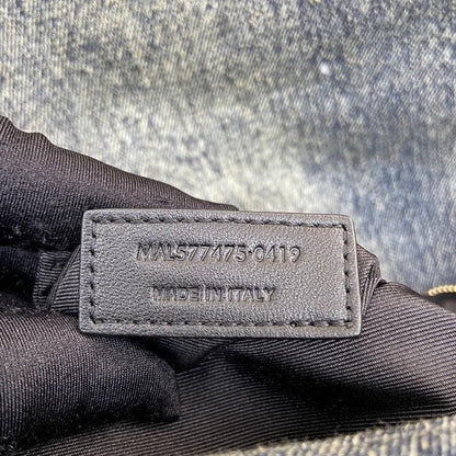 Saint Laurent Loulou Puffer bag in quilted denim.