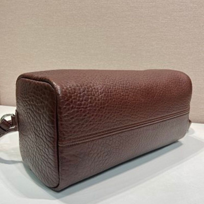 Prada Arqué Leather Tote Bag in a rich cocoa brown.