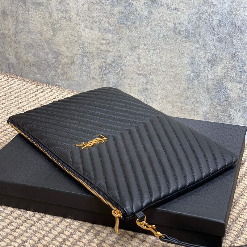 Saint Laurent Matelassé leather pouch with a wrist strap