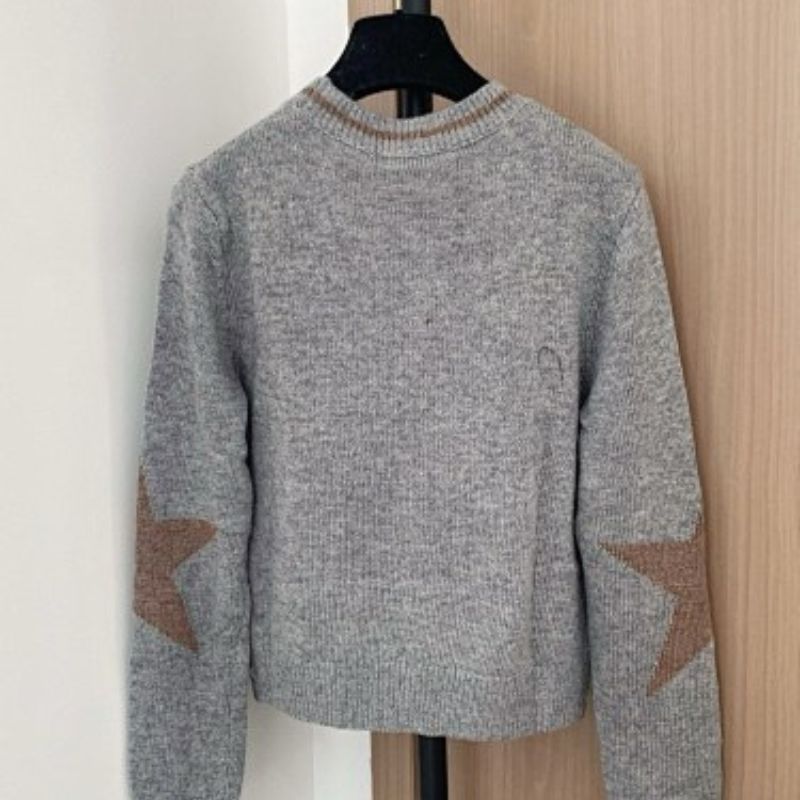 grey Christian Dior cropped sweater with a brown/tan star motif.