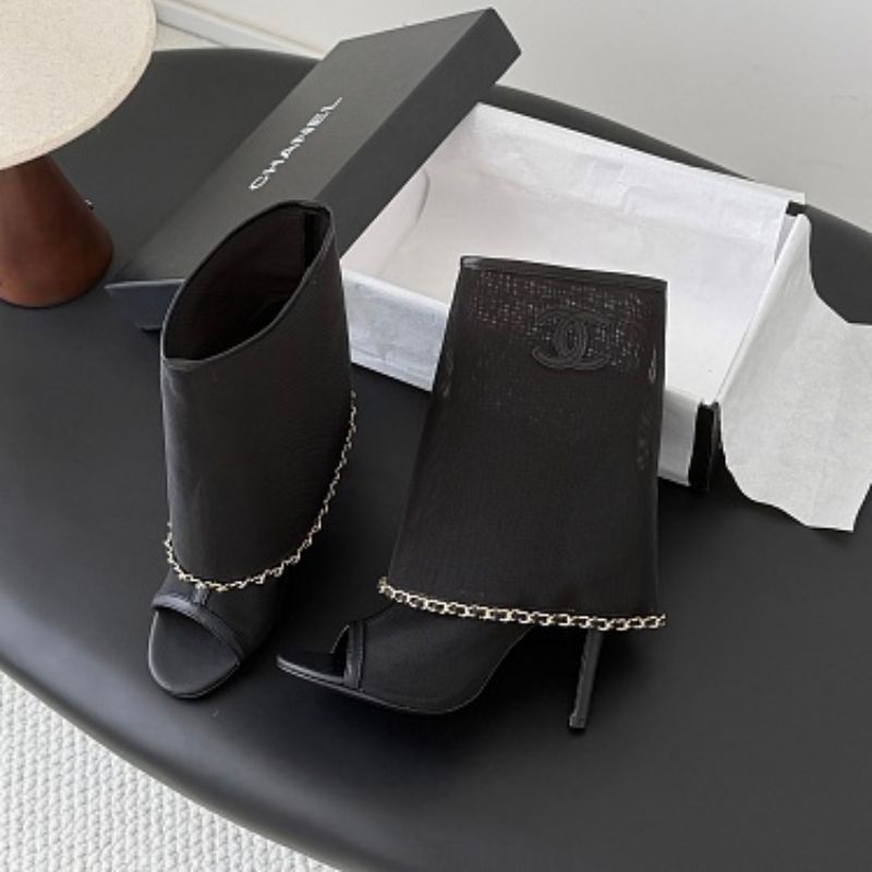 Chanel Mesh Peep-Toe Bootie Sandals in black.