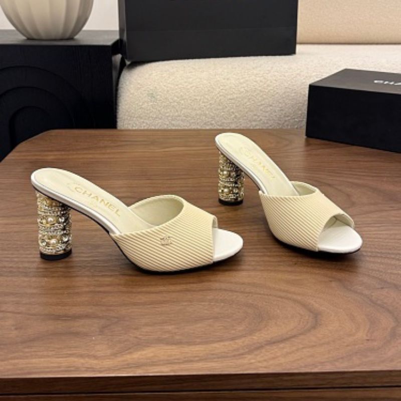 Chanel Ribbed Knit Open-Toe Mules in beige.