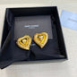 Yves Saint Laurent (YSL) multi-textured heart-in-heart earrings