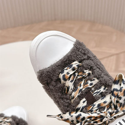Miu Miu Shearling Fur Sneakers.