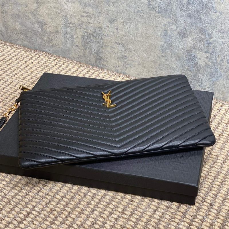 Saint Laurent Matelassé leather pouch with a wrist strap