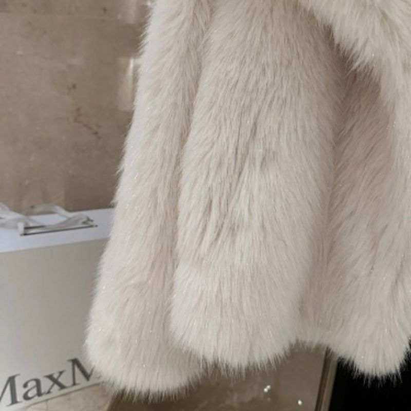 white Christian Dior fur jacket,