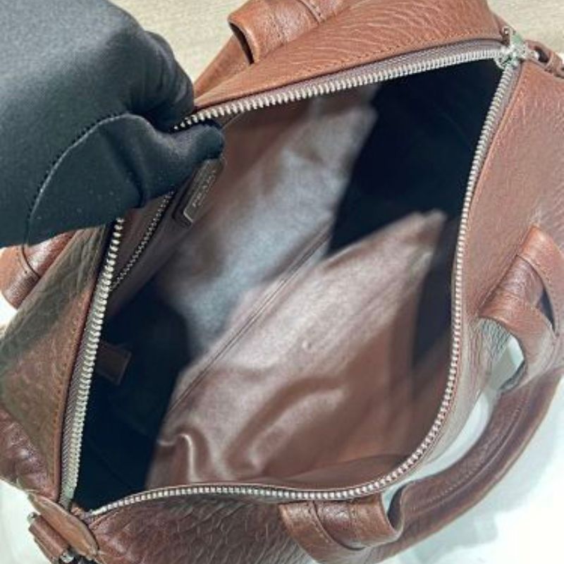 Prada Arqué Leather Tote Bag in a rich cocoa brown.