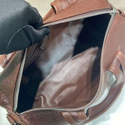 Prada Arqué Leather Tote Bag in a rich cocoa brown.
