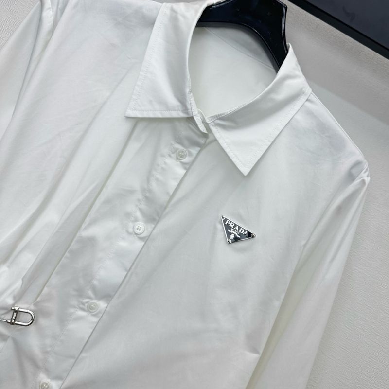 Prada poplin shirt with a pleated panel and safety pin detail.